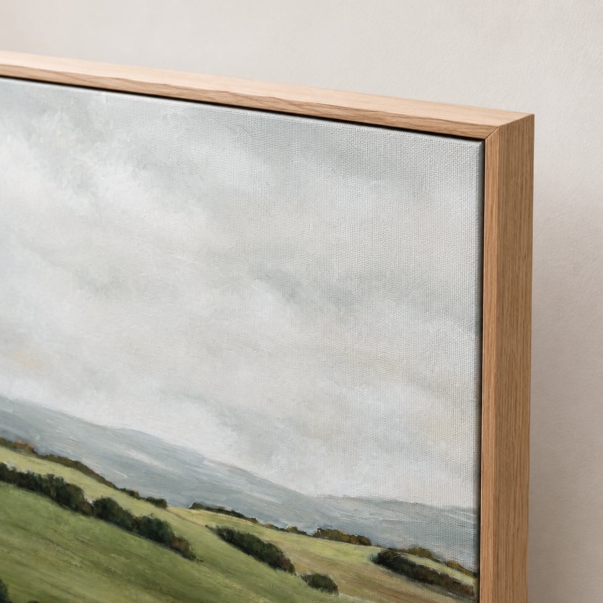 Calm After the Rain by Jeannie — an original Australian landscape painting of green rolling hills under a soft sky, framed in natural oak timber.